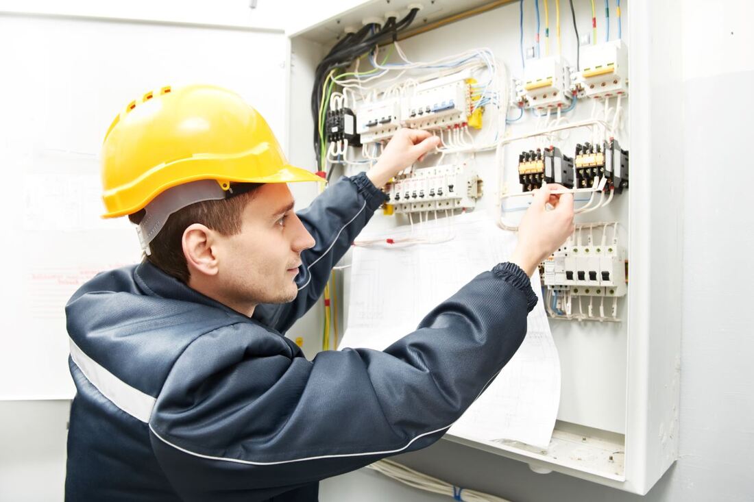 Electrician working on a power distribution system